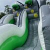 A large Bungee Run with green and white stripes.