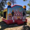 A Circus Tent Bounce House set up in a park.