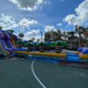 The Cowabunga Slide is a large inflatable slide located on the basketball court.