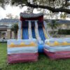 A thrilling Fire Slide (Double Lane Waterslide) stands proudly in front of a house, ready to provide the ultimate double lane waterslide experience.