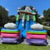 An enchanting Unicorn Slide, adorned with a vibrant rainbow and fluffy clouds, creates a magical experience for all.