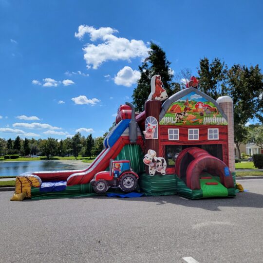 A Farm Bounce House and Slide Combo in the middle of the road.