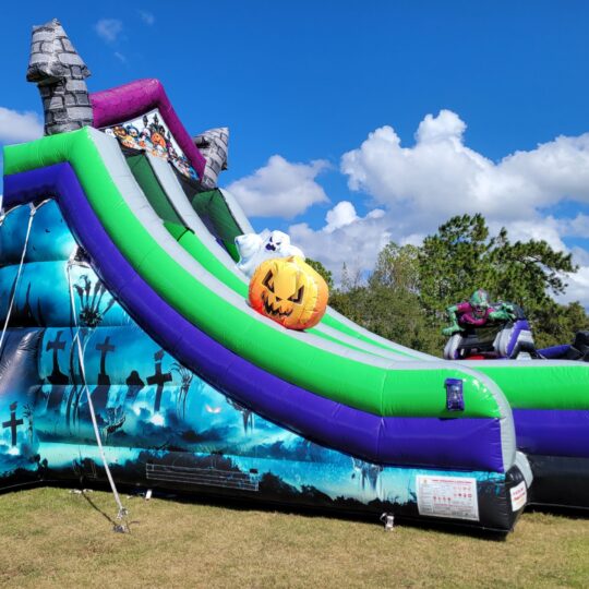 A Halloween 19 Foot Slide in a grassy field.
