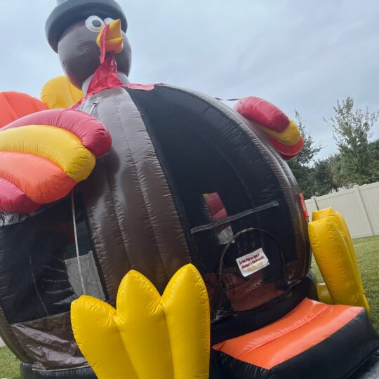 A Turkey Bounce House in a grassy area.