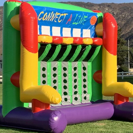 Colorful inflatable Connect-a-Line game on grass