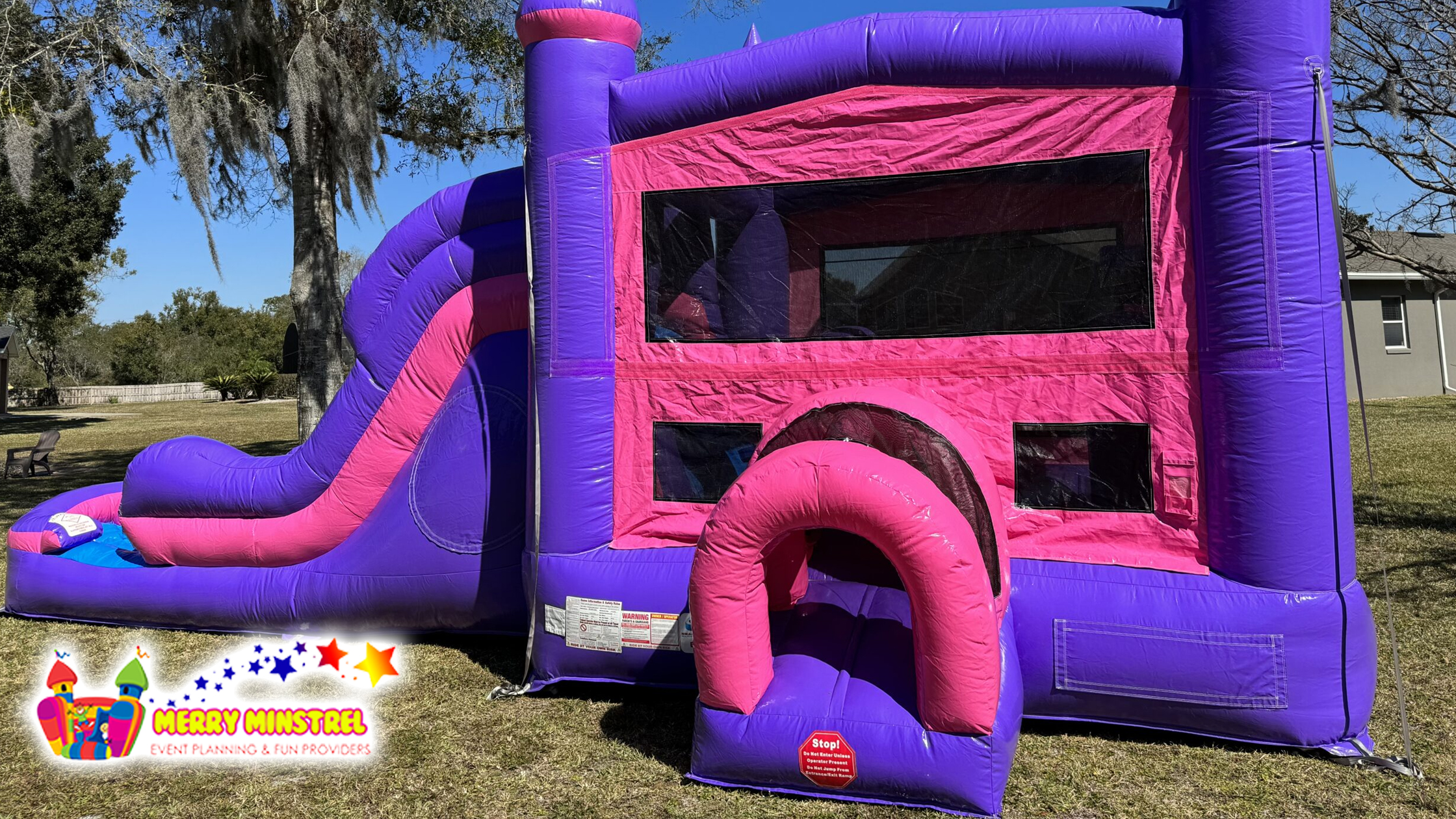 Colorful bounce house and slide combo for a party